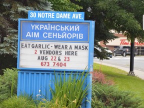 A sign outside the Ukrainian Seniors Centre on Notre Dame Avenue speaks to the times. The organization would ordinarily hold its food fest this coming weekend in Hnatyshyn Park, but instead will have curbside pickup for pyrohy and cabbage rolls on Sunday, along with garlic products from a pair of vendors who will be set up in the parking lot on Saturday and Sunday. Jim Moodie/Sudbury Star