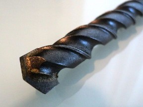 A tungsten carbide-tipped drill bit used for drilling holes through bricks, tiles, and concrete.