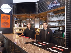 Business partners Attilio Langella, left, and John Law, of Overtime Sports Bar & Grill in Chelmsford, Ont. are busy getting the restaurant ready for opening day on Monday, August 24, 2020. The business, formerly known as Signatures, was purchased in December, 2019. The bar and grill will be open 11 a.m. to midnight from Sunday to Thursday, and 11 a.m. to 2 a.m. on Friday and Saturday.