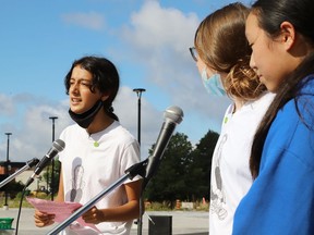 Sophia Mathur, left, participates in a Fridays For a Future Sudbury event at Tom Davies Square on Aug. 21, along with Jane Walker and Maggie Fu.