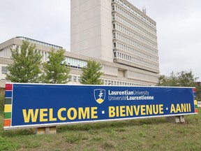 A sign has been erected welcoming back students in three languages at Laurentian University in Sudbury, Ont. on Monday August 24, 2020. John Lappa/Sudbury Star/Postmedia Network