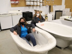 Meghan Smith, left, director of operations for ReStore, and Keri Wilson, Sudbury ReStore manager, show some of the items available at the facility on Notre Dame Avenue in Sudbury, Ont. on Wednesday August 26, 2020. The Sudbury location is now accepting donations of new and used items such as furniture, kitchen cabinets, countertops, appliances, vanities, fireplaces, sinks, tubs, flooring, tiles, lighting fixtures and building material.