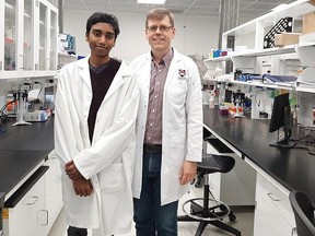 Aaryan Harshith, at left, has developed a device he says can detect cancer cells far more quickly than any conventional device. Harshith, who is 14, moved from the Ottawa area with his parents this summer and will soon be attending Grade 10 in Sudbury. Also shown is Dr. Martin Holcik of Carleton University. Photo Supplied