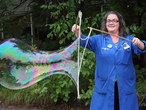 Staff scientist Melissa Radey demonstrates how to make soap bubbles during an outdoor activity at Science North in Sudbury, Ont. on Thursday August 27, 2020.