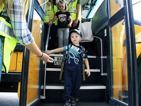 Three-year-old Wyatt Jenkins rides a school bus for the first time at College Boreal in Sudbury, Ont. on Friday August 24, 2018. Sudbury Student Services Consortium officials say this school year will be a challenge given the pandemic. Gino Donato
