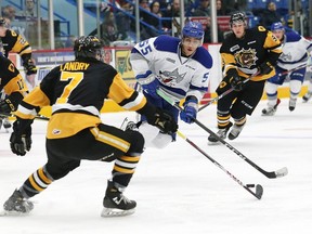 Quinton Byfield, right, of the Sudbury Wolves, attempts to elude Kade Landry, of the Hamilton Bulldogs, during OHL action at the Sudbury Community Arena in Sudbury, Ont. on Friday October 19, 2018. John Lappa/Sudbury Star/Postmedia Network