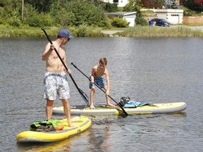 James Alexander and his son Hugo were making a splash, paddle boarding on Gillies Lake on Saturday.

RICHA BHOSALE/The Daily Press