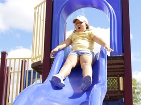 Audrey Lascelle, 6, reacts in anticipation as she goes down the slide at Gillies Lake Beach on a sunny Wednesday afternoon. There is a chance of showers predicted Thursday morning but the Environment Canada forecast calls for a return of mostly sunny conditions Friday and Saturday.

RICHA BHOSALE/The Daily Press