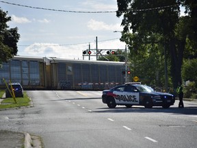 Woodstock police blocked traffic at Ingersoll Road and Main Street Monday afternoon for a police investigation as a train remained stopped on the tracks. (Kathleen Saylors/Woodstock Sentinel-Review)