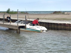 Anglers battle waves pitching their boat from side to side as they navigated the Port Glasgow Marina on Aug. 13. West Elgin council members believe it is only a matter of time until a serious boating mishap occurs and they want government funding to augment the existing piers. Vicki Gough