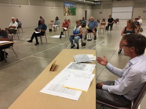 John Michael Spriet (right) answers West Elgin ratepayers questions following his engineering reports on two municipal drains set for reconstruction. The reports on the Crabbe and Yauch drains were presented during a regular council meeting at the Rodney Recreation Centre on Aug. 27. Vicki Gough