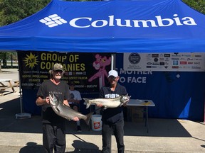 A pair of anglers pose with their catch at the Denis Bester Memorial Shootout weigh-in tent Monday morning. Photo supplied.