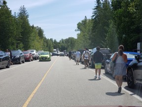 Vehicles are parked along both shoulders of the road leading to the Bruce Peninsula National Park visitor centre during the weekend of Aug. 8-9. Parks Canada staff have redirected over 5,000 vehicles trying to access The Grotto without a parking reservation, and those who showed up too late to park at one of the first-come-first-served parking lots within the park. Supplied photo.