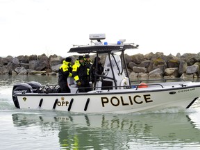 The OPP’s underwater search and recovery unit leaves Harbour Marina in Port Dover in search of a man who fell off a fishing tug about 15 kilometres west of Long Point. Photo taken March 25, 2020. (Monte Sonnenberg, Postmedia Network)