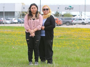 Mary Quesada and her 16-year-old daughter Ariana Quesada pose for a photo at the Cargill plant in High River, Alberta. Mary's husband, Benito Quesada, an employee at the Cargill plant, recently passed away due to complications from COVID-19 Monday, May 25, 2020.