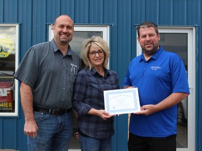 Chad and Kerry Tourand are presented with a certificate by Chamber president Marlon Zacharias, in this file photo. People wanting to help feed school children in Nipawin this year can donate at Rona Pinecrest Lumber and the parent company will kick in some money too.