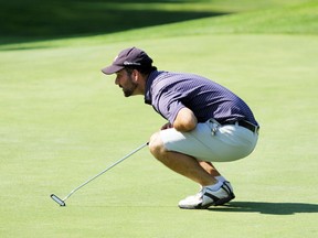 PETER RUICCI/Sault Star

Tyler Kasubeck lines up a putt on the 18th green, en route to winning the Sault Golf Club's men's championship