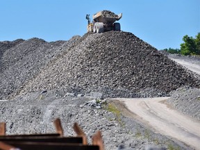 Heavy equipment continues to offload aggregates on site at Picton Terminals. Municipalities are asking the province to review the way aggregate operations are taxed. (DEREK BALDWIN/Postmedia file photo)