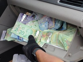 Ontario Provincial Police officers seized more than $45,000 in Canadian currency from a vehicle found speeding on Highway 69 near Wanup on Sunday. OPP PHOTO