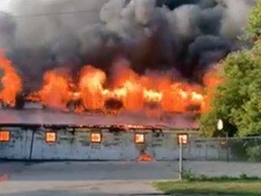 Firefighters are battling a massive barn fire at the Woodstock Fairgrounds. (Facebook)