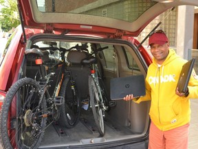 Multicultural Association of Perth Huron founder Dr. Gezaghn Wordofa prepares to deliver donated bikes and laptops to migrant workers in the region Wednesday afternoon. (Galen Simmons/The Beacon Herald)