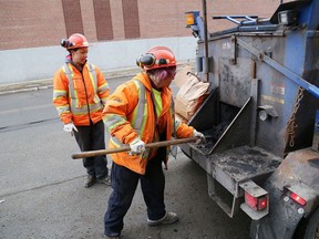 A city road crew repairs potholes on Grey Street in Sudbury on Thursday. A pilot project could revolutionize pothole-patching and road work in Sudbury. JOHN LAPPA/POSTMEDIA NETWORK