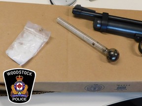 Woodstock police charged a man with imitation weapons and drug offences after a call on Tuesday for a report of a man with a gun. Pictured, police said they located a pellet gun, a pipe and crystal meth on a suspect. (Courtesy Woodstock police)