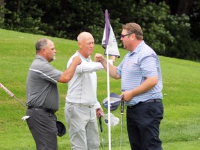 PETER RUICCI/Sault Star 
Don Martone (left) and Richard Evoy congratulate Ryan Bastien (right), winner of the 2020 Labour Day Open championship on Sunday at Sault Golf Club.