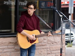 Jonah Atkins played on Norfolk St. S. during the inaugural Sounds from the Sidewalk event in downtown Simcoe. This BIA event is expected to take place for the next few Saturdays from 12:30 p.m. to 2 p.m. (ASHLEY TAYLOR)