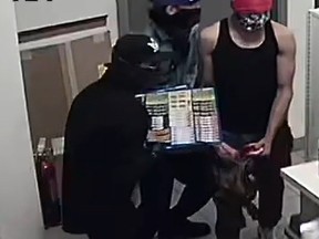 Woodstock police have released surveillance footage of three suspects following a robbery on Wednesday night. (Woodstock police)