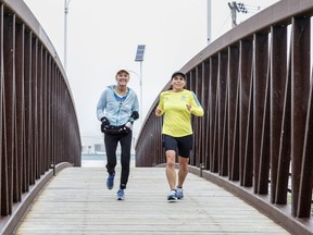Peace River residents ran the Virtual Boston Marathon on Sept. 7, 2020, in commemoration of the race that was cancelled this year. Above, coming over the bridge is Diane Brodeur (left) and Julie Gummeson, who is her supporting runner.