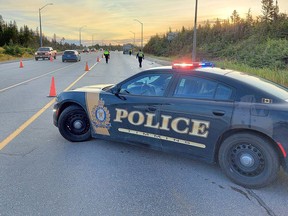 A Timmins Police Service cruiser blocks off the flow of traffic on Highway 101, just east of Schumacher, Tuesday morning. Provided