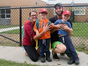 Jessica and Justin Corner picked up their four-year-old twins, Ty and Bastian, from their first day of Junior Kindergarten at St. Frances Cabrini School in Delhi on Tuesday afternoon. (ASHLEY TAYLOR)