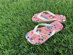 A child's flipflops give some context to what appears to be a very healthy lawn. The photograph was taken this week. Gardening expert John DeGroot says homeowners have faced some special challenges this summer because of the hot, dry weather. Maintaining a healthy lawn has taken a lot of extra work. John DeGroot photo