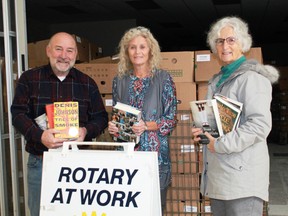 Rotary Club of Sarnia Bluewaterland members John Girard, Jean Cowper and Camilla McGill prepare for their annual book sale in this January 2020 photo. With COVID-19 forcing the cancellation of two of their major fundraisers – the book sale and Art in the Park – the club is hosting a fish’n’chips fundraiser on Sept. 18, and plans to hold more small scale fundraisers in the future. File photo/Postmedia Network