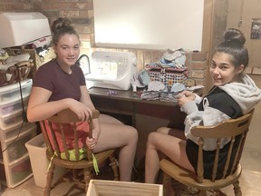 Youth Task Team members Lillian Taylor (left) and Olivia Corneil have been busy sewing approximately 100 masks for free distribution to youth ages 12 to 19 in the communities of Dutton Dunwich and West Elgin. Handout