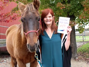 Sharon Campbell-Rayment is pictured with her horse Malachi, a Rocky Mountain breed, near Kent Bridge, Ont. in this file photo taken October 26, 2016 after the release of her book 'Falling into the Rhythm of Life: Life Lessons Straight from the Horse's Mouth. Malachi has been missing since early Saturday which has resulted in local residents helping the search including using drones and airplanes.  Ellwood Shreve/Chatham Daily News/Postmedia Network