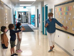 Students at Saint John XXIII in Fort Saskatchewan learn the guidelines for physical distancing and COVID-19 precautions. Photo via Twitter
