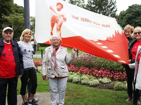 The annual Terry Fox Run in Sarnia is going virtual this year. Organizers and participants are pictured in 2018 raising the Terry Fox flag at Canatara Park. From left are Leo Arts, Laurie Rome, Francien Arts, Jane Nicholson, Sue Hamill, and Sheila Fitzsimons. (Observer file photo)