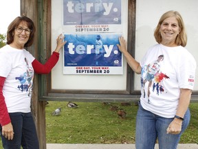 Cathy Davis, left, chairwoman of the local Terry Fox Run Committee, and committee member Maria Sheculski were busy putting up signs and posters at Gillies Lake this week to remind the public to participate in the upcoming virtual Terry Fox Run event on Sunday, Sept. 20. RICHA BHOSALE/THE DAILY PRESS