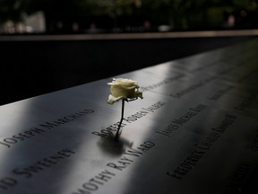 A rose is placed on one of the victims' names at the south reflecting pool of the National 9/11 Memorial, two days before the 19th anniversary of attacks in the lower section Manhattan, New York City, on Wednesday. (Shannon Stapleton/Reuters)