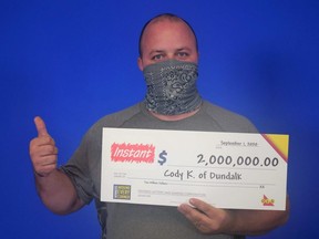 Cody Kane of Dundalk with his $2-million cheque from OLG.