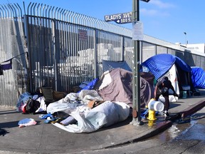 Tents of the homeless line a streetcorner in Los Angeles, California on January 8, 2020. - California Governor Gavin Newsom said his state budget will include more than $1 billion directed towards homelessness, in response to a growing crisis on the streets on California's major cities. (Photo by Frederic J. BROWN / AFP) (Photo by FREDERIC J. BROWN/AFP via Getty Images)