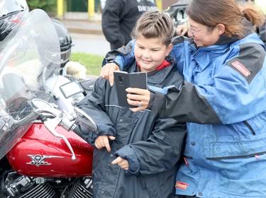 Reid Vince, 9, and her mother, Tambi Vince, prepare for 27th annual Bikers Rights Organization's toy run to benefit Women in Crisis (Algoma) at A&W, 659 Great Northern Rd., in Sault Ste. Marie, Ont., on Saturday, Sept. 12, 2020. (BRIAN KELLY/THE SAULT STAR/POSTMEDIA NETWORK)