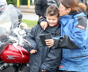 Reid Vince, 9, and her mother, Tambi Vince, prepare for 27th annual Bikers Rights Organization's toy run to benefit Women in Crisis (Algoma) at A&W, 659 Great Northern Rd., in Sault Ste. Marie, Ont., on Saturday, Sept. 12, 2020. (BRIAN KELLY/THE SAULT STAR/POSTMEDIA NETWORK)