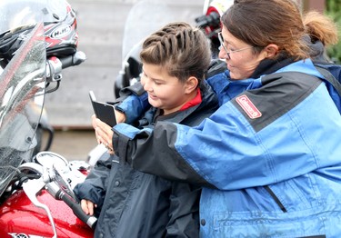 Reid Vince, 9, and her mother, Tambi Vince, prepare for 27th annual Bikers Rights Organization's toy run to benefit Women in Crisis (Algoma) at A&W, 659 Great Northern Rd., in Sault Ste. Marie, Ont., on Saturday, Sept. 12, 2020. (BRIAN KELLY/THE SAULT STAR/POSTMEDIA NETWORK)