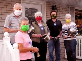 Residents of the Dora Drive neighbourhood in Simcoe gathered for one last round of pot-banging Friday in recognition of the risks taken by essential front-line workers during this time of pandemic. Among them were, from left, Tom and Liz Harvey, Maggie Moore and Jim and Cathy Schott. – Monte Sonnenberg