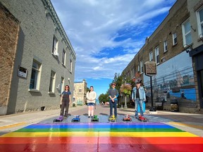 Organizers of a rainbow crosswalk project in Kincardine stand with the new feature on Harbour Street. Pictured, from left to right, are: Ashley Richards, director of the Kincardine & District Chamber of Commerce; Siobhan Farrell, member of Kincardine's arts, culture and heritage committee; Michael Yun, chair of the arts, culture and heritage committee; and Rick Clarke, downtown development manager for the Kincardine BIA. SUPPLIED