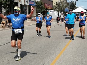 Pete Richards (L) ran a virtual Boston Marathon on Sunday, September 6, through Kincardine. The Boston Marathon was cancelled this year due to COVID, but those who qualified were still invited to run the distance of 42km through their own hometowns. Richards has run the Boston Marathon three times. Hannah MacLeod/Kincardine News