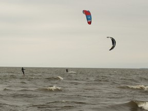 Andrew Morrison, foreground, and Greg Dancey get a bit of kiteboarding in on Lake Nipissing, Wednesday. 
PJ Wilson/The Nugget